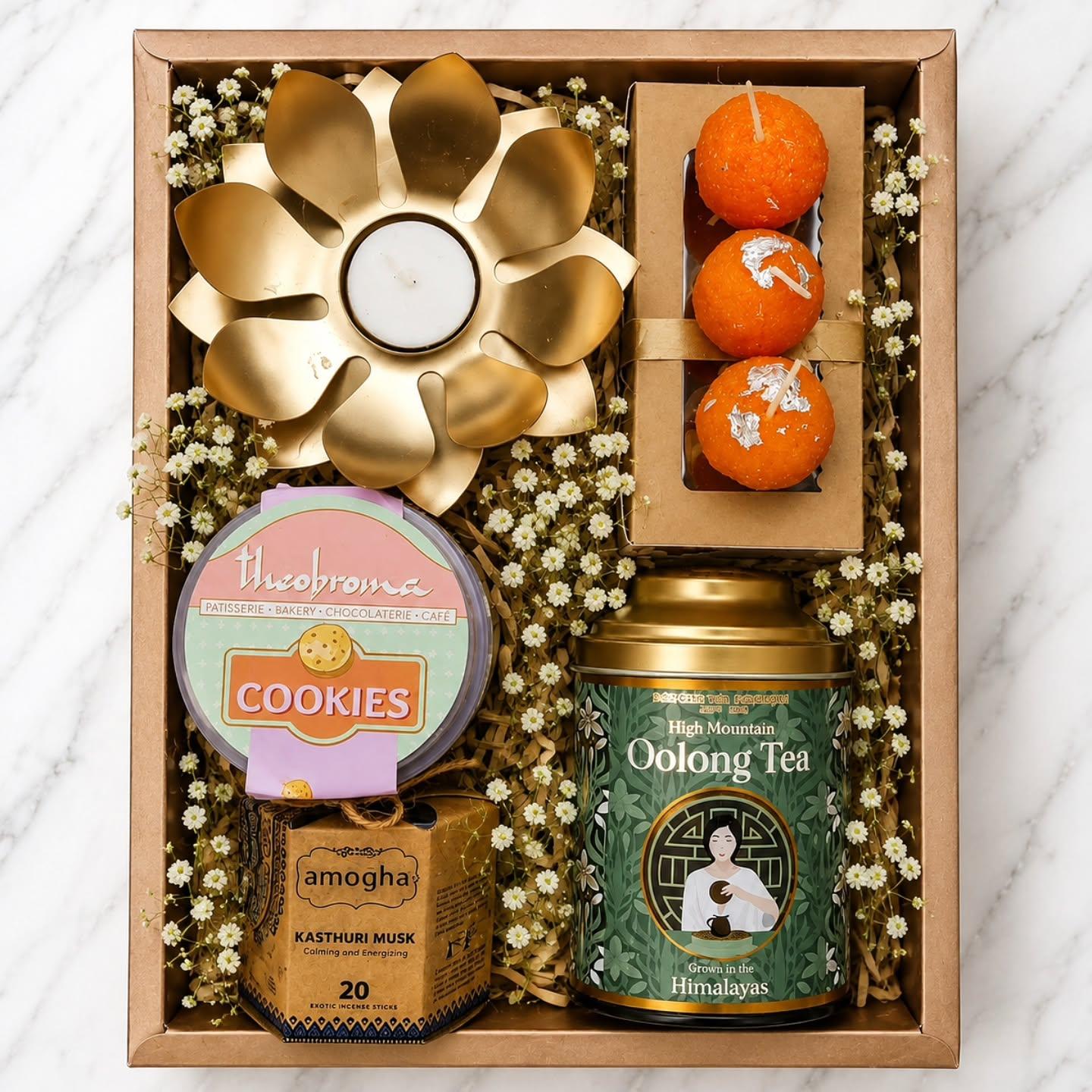 Diwali hamper with tea, cookies and candle